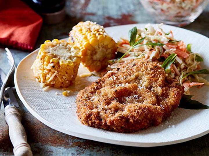 Rosemary beef schnitzel with coleslaw and corn 